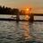 two students kayaking in the sunset