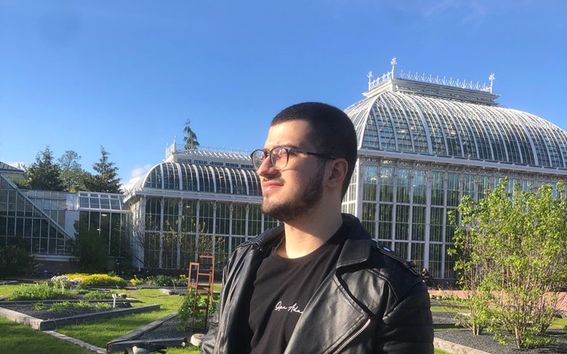 San standing outside of the Botanical Garden.