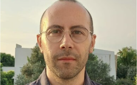 Portrait photo of Antonio Lieto in glasses outdoors
