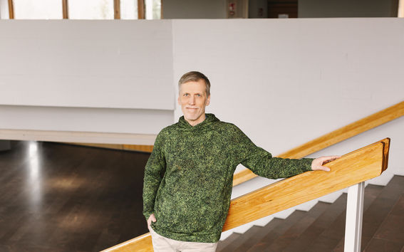 Iivo Vehviläinen standing in a staircase.