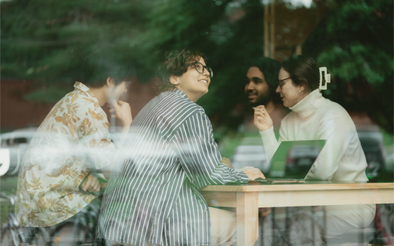 Students chatting together at a table