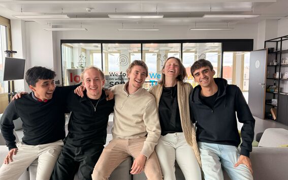 5 students sitting on a couch