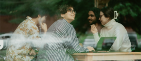Students chatting together at a table