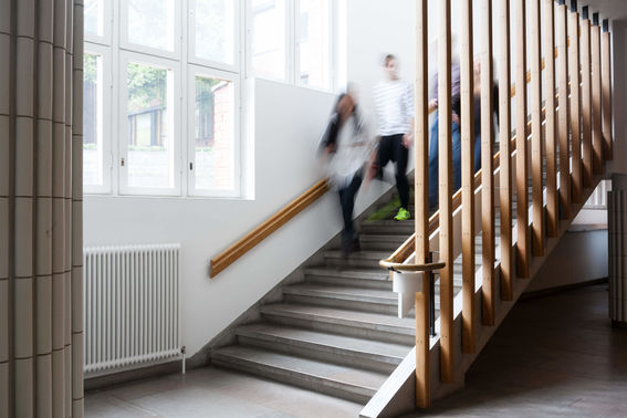 Group of people walking down stairs