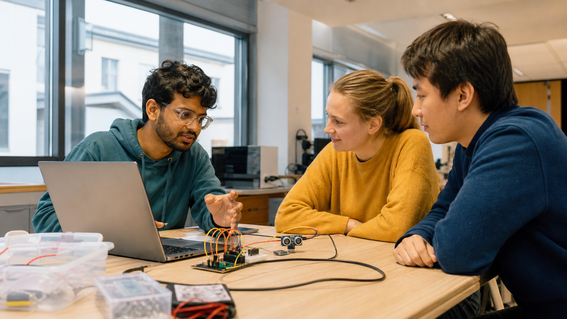 student describing a hardware project to head team mates in educational setting