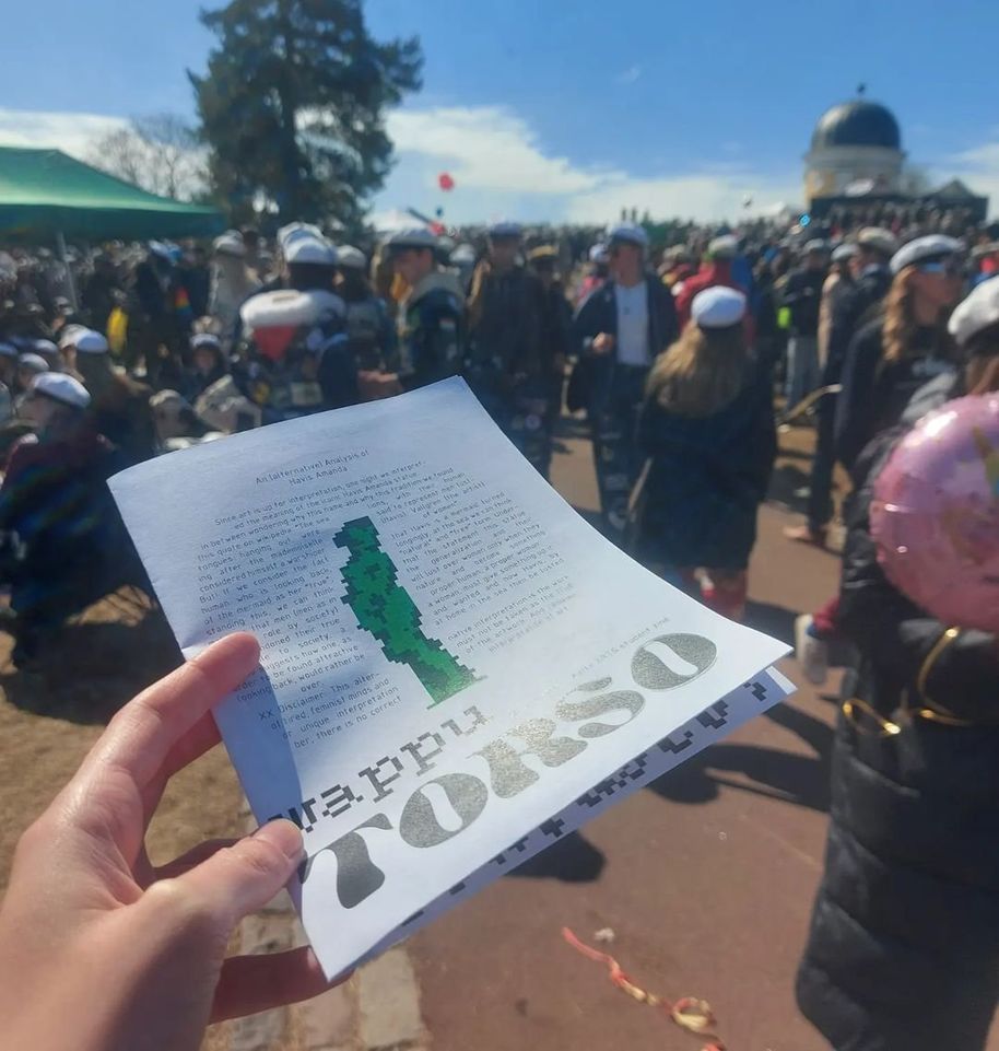 A person holding a leaflet called Wappu Torso