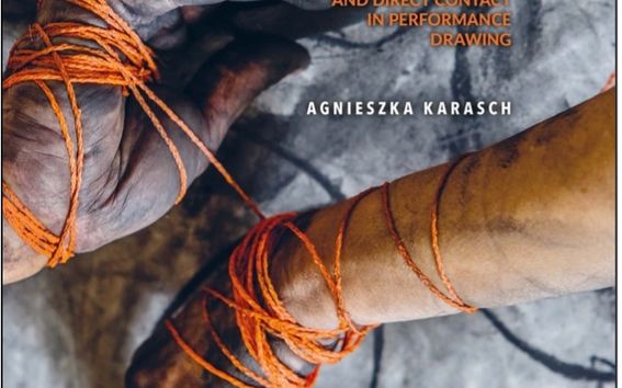 Cover image of Agnieszka's thesis. Two hands dirty with charcoal intertwined with orange thread. 