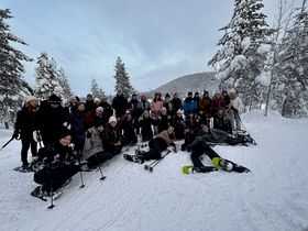 A group of students skiing in Lapland.