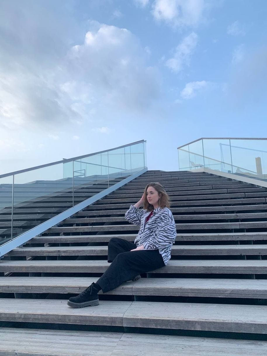 Kasia sitting on Loyly's stairs