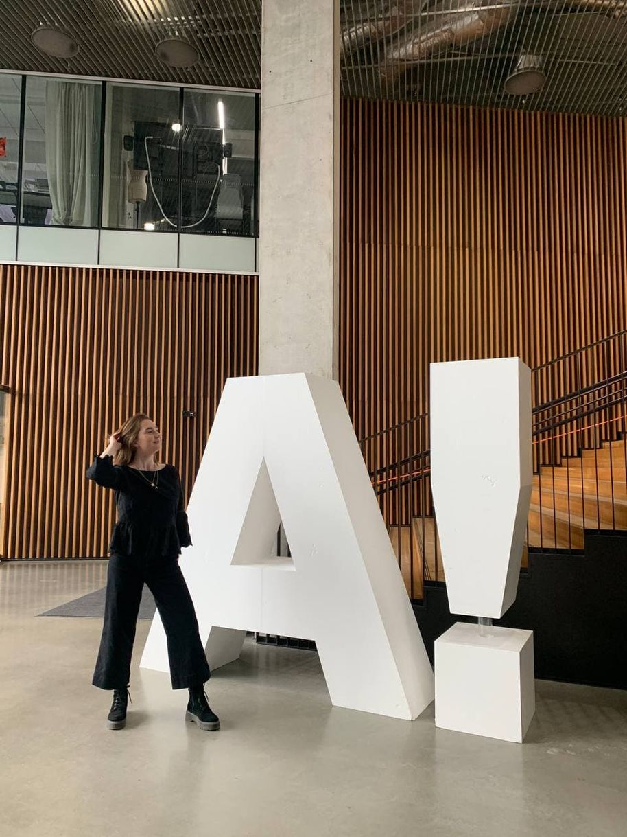 Kasia standing in front of the A! letter